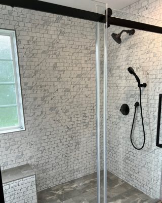 Bathroom remodeling in Clarksville TN with custom tile shower, glass enclosure, and quality contractor finishes